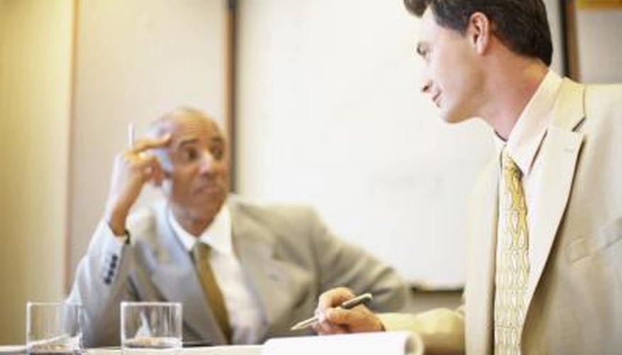 Photo Credit: Purestock/Purestock/Getty Images Shareholder and executive in meeting