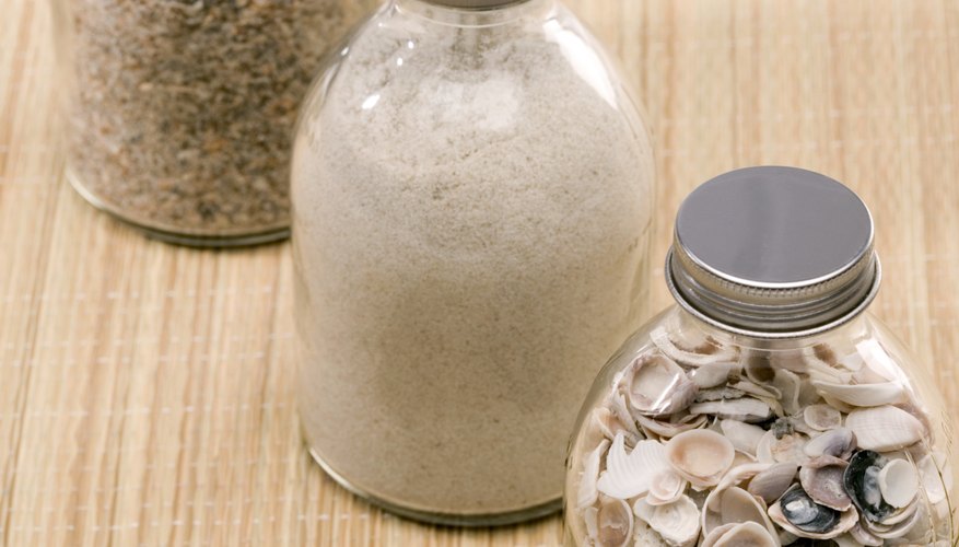 Jars of sand, pebbles and shells collected on vacations add ambiance and memories to your house. Jars of sand, pebbles and shells collected on vacations add ambiance and memories to your house.