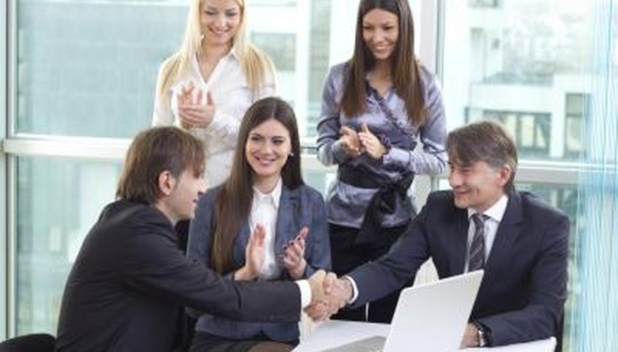 Photo Credit: Sneksy/iStock/Getty Images Employee being congratulated for a job well done