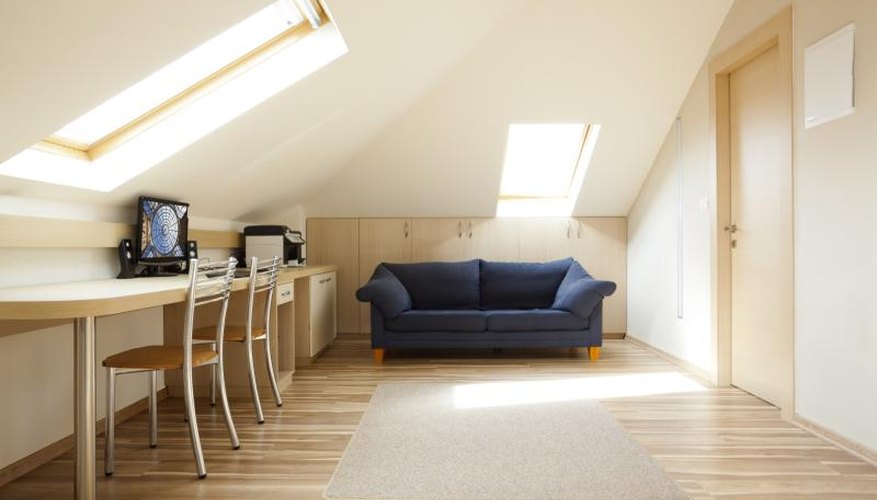 The interior of a minimal office in the attic of a home. The interior of a minimal office in the attic of a home.