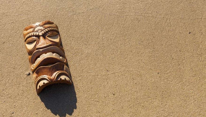 Tiki mask on sand. Tiki mask on sand.
