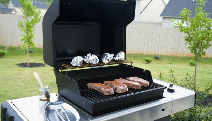 Gas grill with food.