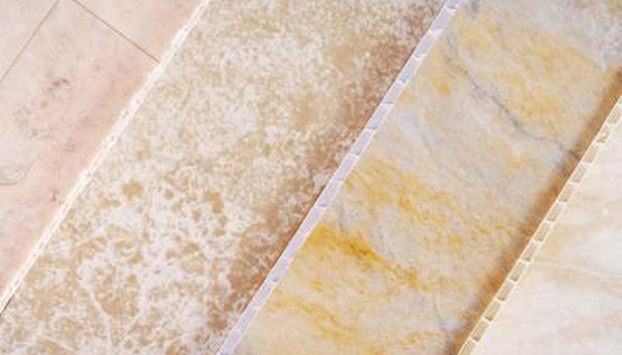 Four panels of vinyl floor samples lying next to one another for comparison. Four panels of vinyl floor samples lying next to one another for comparison.