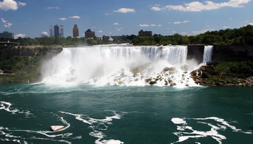 Photo Credit: Niagara Falls image by Gina Smith from <a href='http://www.fotolia.com'>Fotolia.com</a> Niagara Falls, a large-scale example of mass flow and volume flow