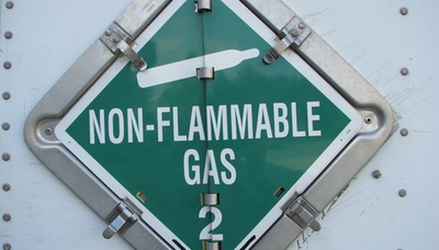 Photo Credit: non-flammable gas class 2 placard image by k9dg from <a href='http://www.fotolia.com'>Fotolia.com</a> Proper signage is required for potentially dangerous work areas.