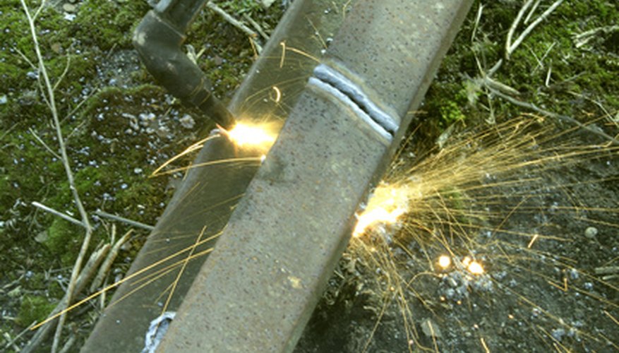 Photo Credit: welding image by Kaarel from <a href='http://www.fotolia.com'>Fotolia.com</a> Knowing how specific metals will weld together is important to each welding job.