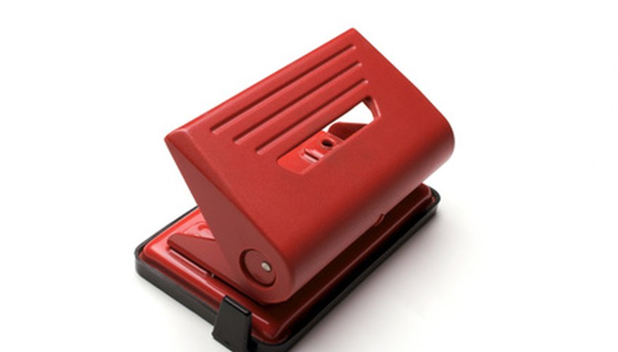 Photo Credit: red hole puncher image by dana nicolescu from <a href='http://www.fotolia.com'>Fotolia.com</a> The medical and legal professions use the two hole punch.
