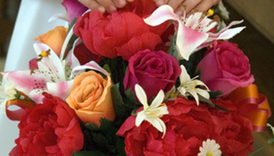 Photo Credit: Flower Girl and Basket of Flowers image by TMLP from <a href='http://www.fotolia.com'>Fotolia.com</a> Fresh flower arrangements need to be kept cool.