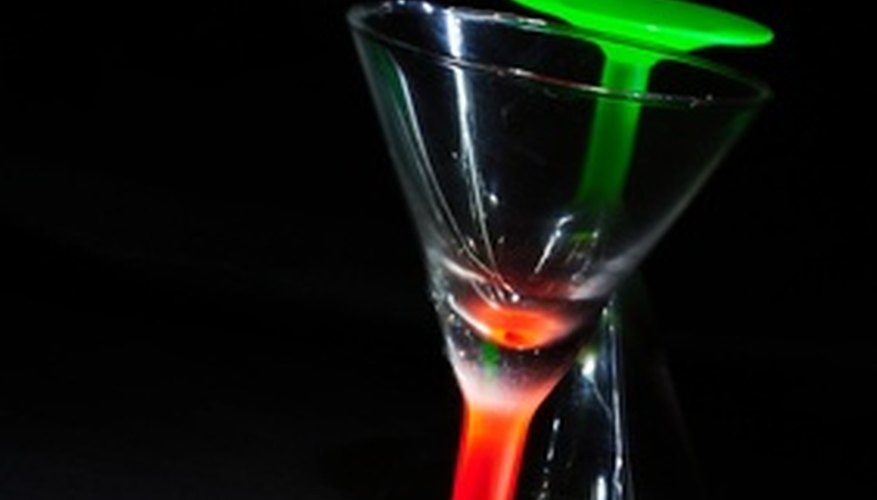 Photo Credit: red glass green glass image by Roman Kyrychenko from <a href='http://www.fotolia.com'>Fotolia.com</a> Use the rocks to score glass.