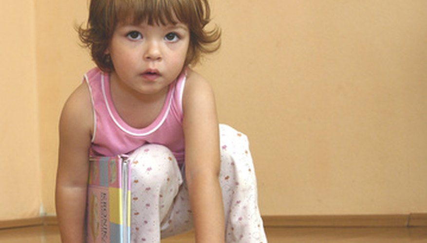 Book handling is an early literacy behavior. Book handling is an early literacy behavior.