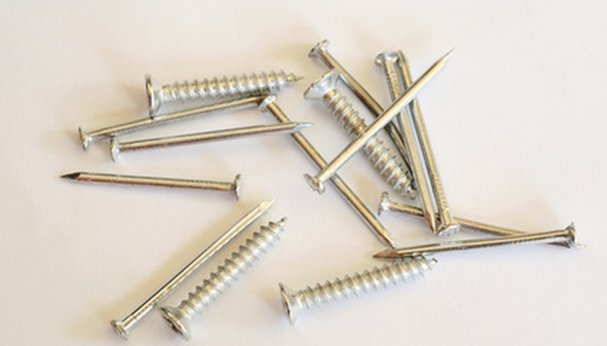 Photo Credit: Nails and screws image by Elzbieta Sekowska from <a href='http://www.fotolia.com'>Fotolia.com</a> Large nails or screws could split the wood.