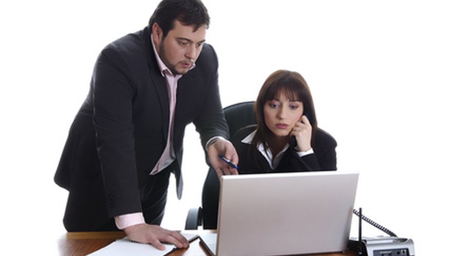 Photo Credit: in a office image by Marin Conic from <a href='http://www.fotolia.com'>Fotolia.com</a> An LLC could be a partnership or corporation.