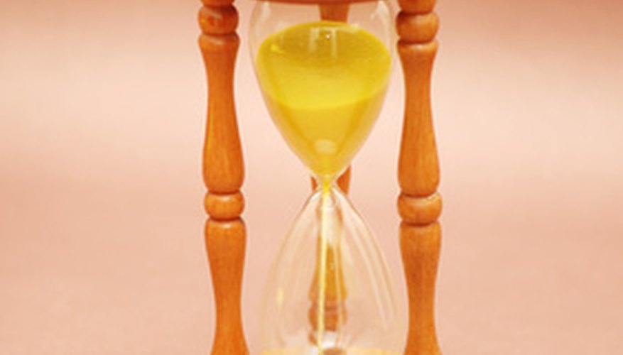 Photo Credit: wooden hourglass against brown background image by Elnur from <a href='http://www.fotolia.com'>Fotolia.com</a> Effective performance review goals have time limits.