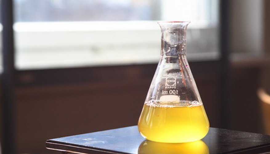 Photo Credit: experiment image by martin schmid from <a href='http://www.fotolia.com'>Fotolia.com</a> Calculating frequency factor in chemical kinetics