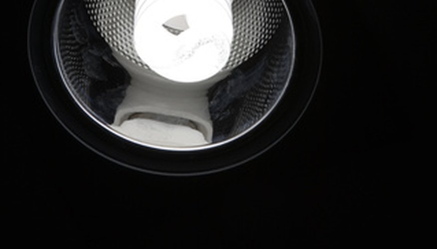 This compact fluorescent light bulb is installed in a recessed can.