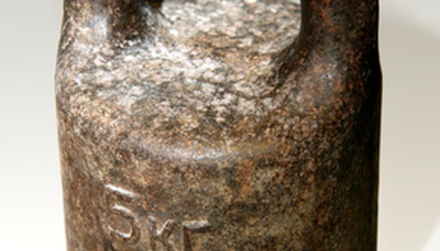 Photo Credit: metal weight . image by Yuri Bizgaimer from <a href='http://www.fotolia.com'>Fotolia.com</a> To calculate density, divide mass by unit volume.