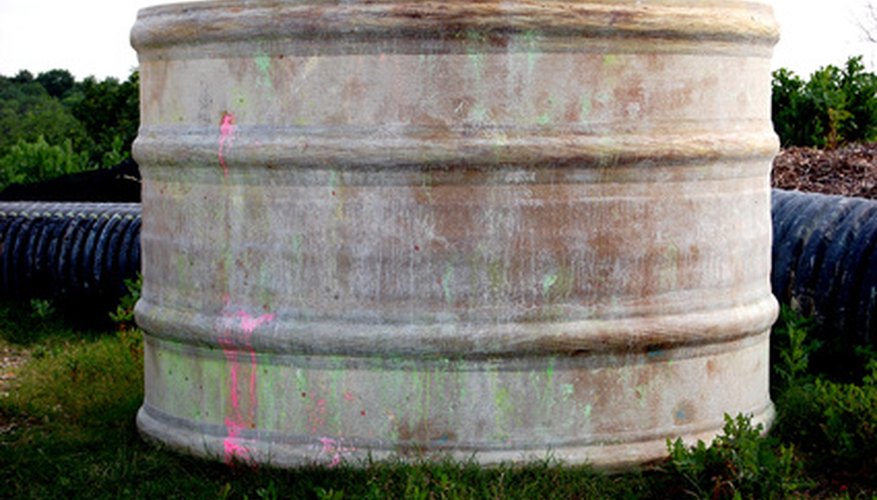 Photo Credit: paint ball cylinder. image by Empath from <a href='http://www.fotolia.com'>Fotolia.com</a> Cylinder volumes are often expressed using cubic measurements.