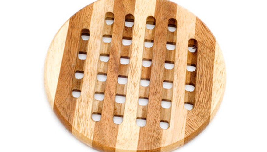 Photo Credit: wood bench insulator image by Aleksandr Ugorenkov from <a href='http://www.fotolia.com'>Fotolia.com</a> Wood is an insulator.