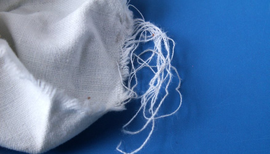 Use a rag to soften and wipe away as much glue residue as possible. Use a rag to soften and wipe away as much glue residue as possible.