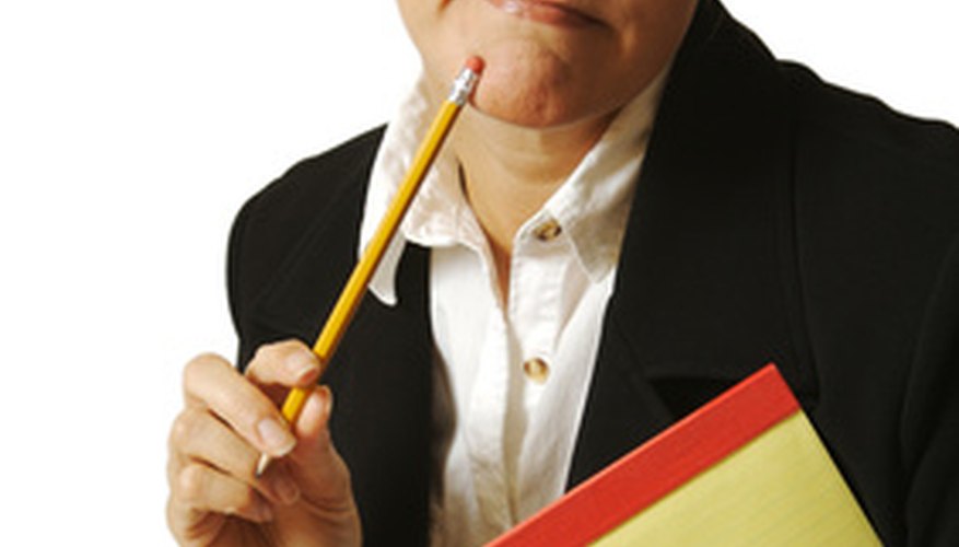 Photo Credit: Beautiful Woman Thinks with Pencil & Notepad. image by Andy Dean from <a href='http://www.fotolia.com'>Fotolia.com</a> The reverse mortgage valuation mystery.