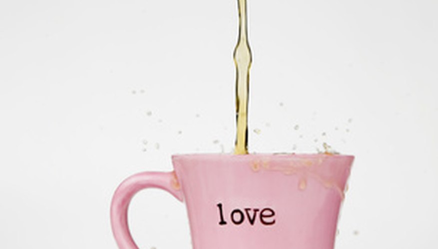 Photo Credit: Coffee Splash Love Mug image by Scott Griessel from <a href='http://www.fotolia.com'>Fotolia.com</a> Valentine's Day offers an opportunity to sell associated specialty mugs.