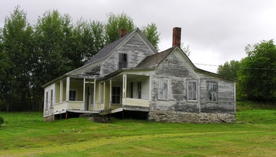 Photo Credit: old house image by Tom Oliveira from <a href='http://www.fotolia.com'>Fotolia.com</a> Make required repairs from reverse mortgage proceeds.
