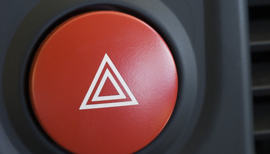 a large red hazard warning light button