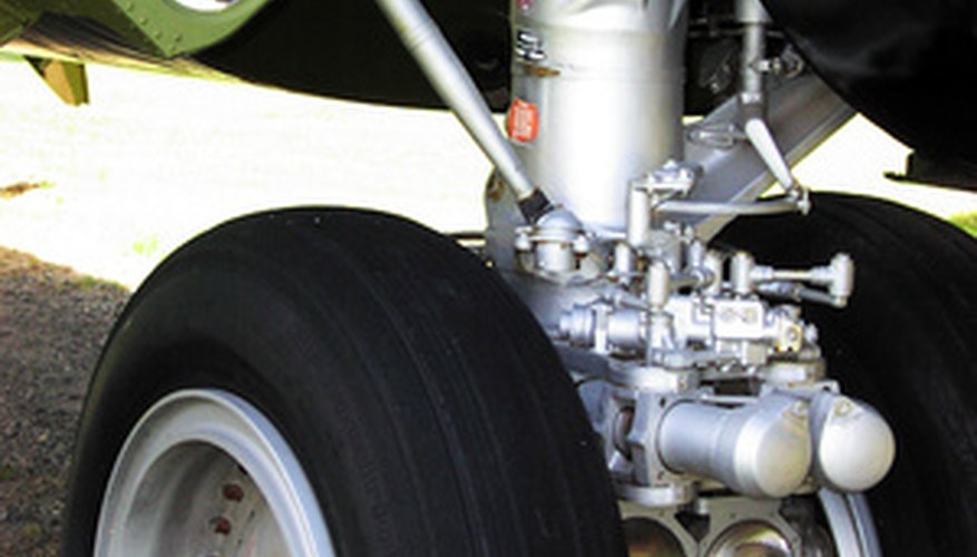 Photo Credit: landing gear image by Micah Jared from <a href='http://www.fotolia.com'>Fotolia.com</a> Airplane landing gear often contains 4340 alloy steel.