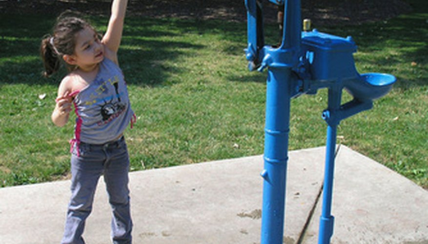 Photo Credit: at the pump image by nutech21 from <a href='http://www.fotolia.com'>Fotolia.com</a> Calculating the head on a submersible pump can provide information about the how well the pump works.
