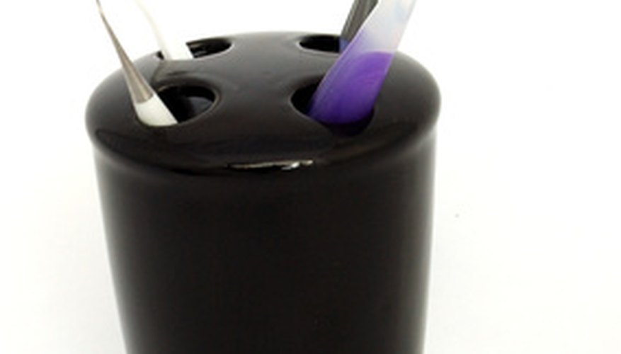 Photo Credit: toothbrush holder image by Jeffrey Sinnock from <a href='http://www.fotolia.com'>Fotolia.com</a> Use a variety of tools to make your point.