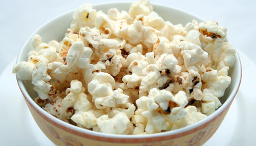 Photo Credit: Popcorn image by Yvonne Bogdanski from <a href='http://www.fotolia.com'>Fotolia.com</a> Food is a popular fundraising product
