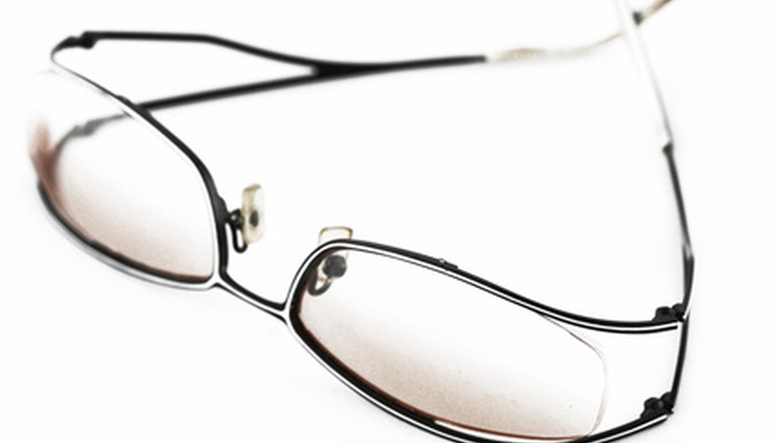 Optometrists prescribe corrective lenses to patients.