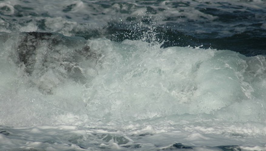 Photo Credit: ocean image by sergey2008 from <a href='http://www.fotolia.com'>Fotolia.com</a> The great oceanic currents interact with the atmosphere to influence weather.