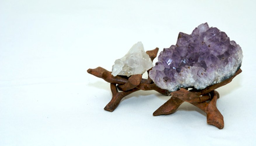 Photo Credit: Quartz Crystal and Amethyst Crystal image by Stephen Orsillo from <a href='http://www.fotolia.com'>Fotolia.com</a> Growing the perfect crystal