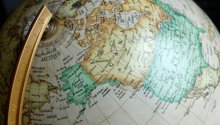 Photo Credit: globe image by danimages from <a href='http://www.fotolia.com'>Fotolia.com</a> Latitude and longitude lines form a grid on the globe.