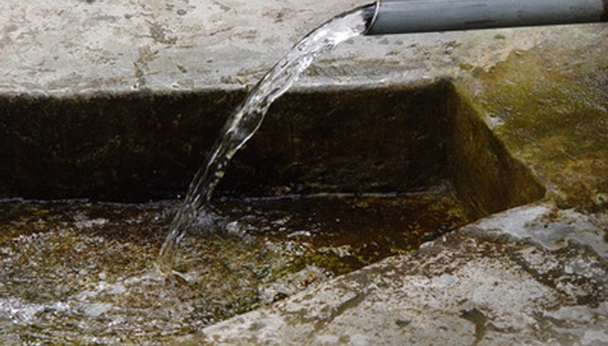 Some water pumps are attached to a drainage pipe. Some water pumps are attached to a drainage pipe.