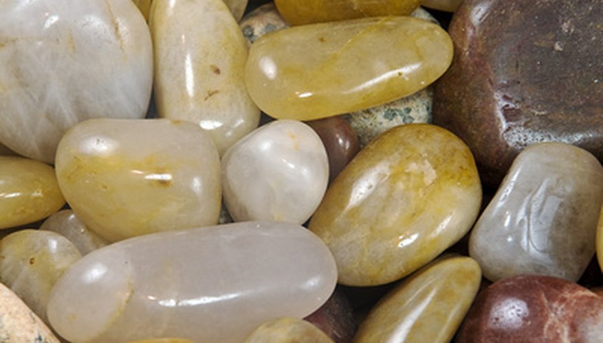 Photo Credit: STONES image by brelsbil from <a href='http://www.fotolia.com'>Fotolia.com</a> Rounded, smooth stones after the second tumbling stage.