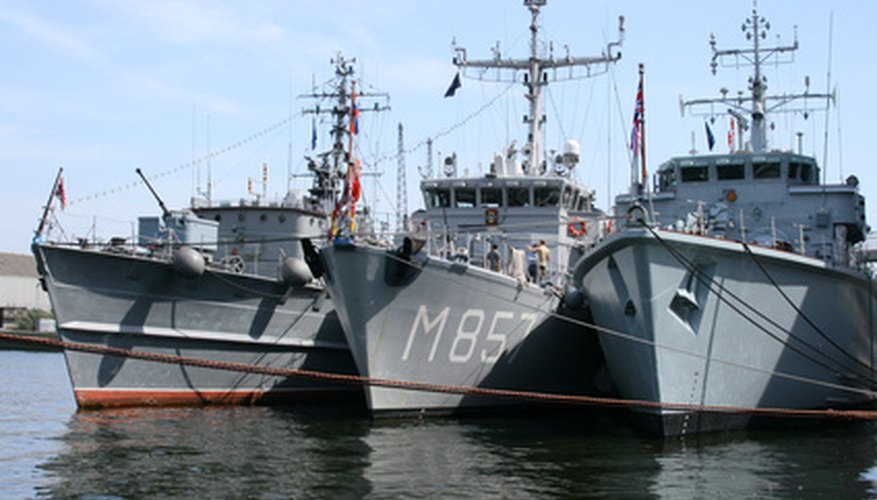 Photo Credit: moored naval ships image by Christopher Dodge from <a href='http://www.fotolia.com'>Fotolia.com</a> Members of a (maritime) fleet support each other, and each unit contributes to the company's success.