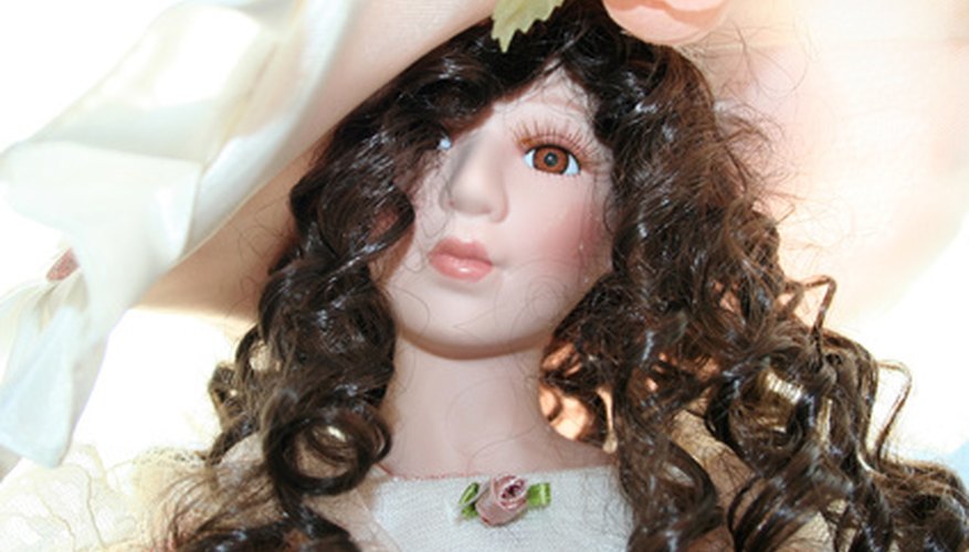 Cover the doll head and wig with a washcloth to protect it while you work. Cover the doll head and wig with a washcloth to protect it while you work.