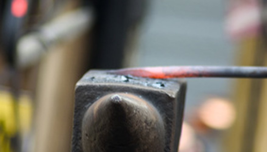 Photo Credit: blacksmith working image by pixelcarpenter from <a href='http://www.fotolia.com'>Fotolia.com</a> Construct your own forge.