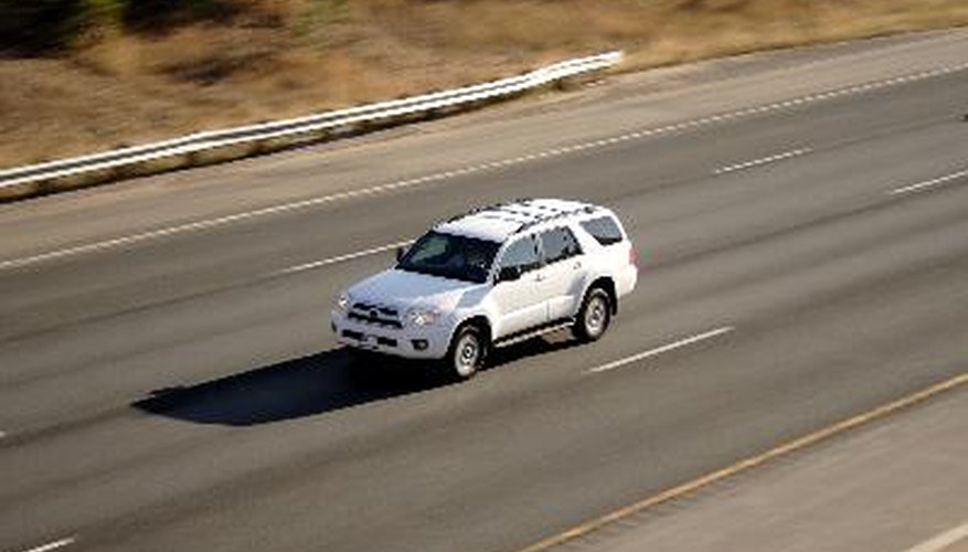 Pan Blur of White Vehicle on Highway