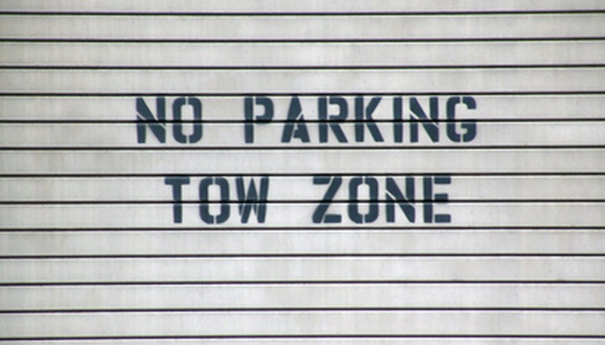 Different types of tow trucks hook up to cars in different ways.