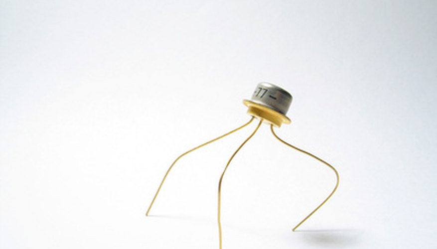 Photo Credit: transistor image by Aleksandr Lukin from <a href='http://www.fotolia.com'>Fotolia.com</a> The three legs in the image are base, collector and emitter.