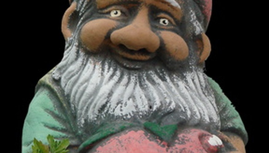 A brightly painted gnome can accent your outdoor garden. A brightly painted gnome can accent your outdoor garden.