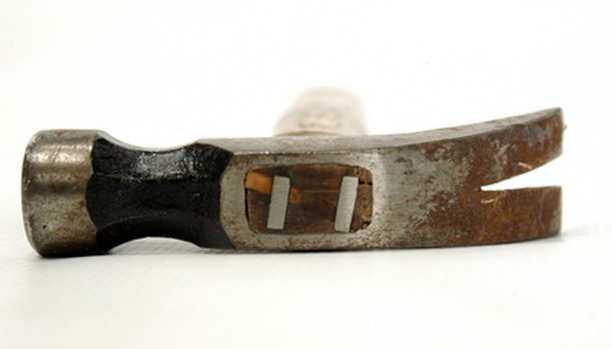 Metal wedges help to secure the wooden handle to the head. Metal wedges help to secure the wooden handle to the head.