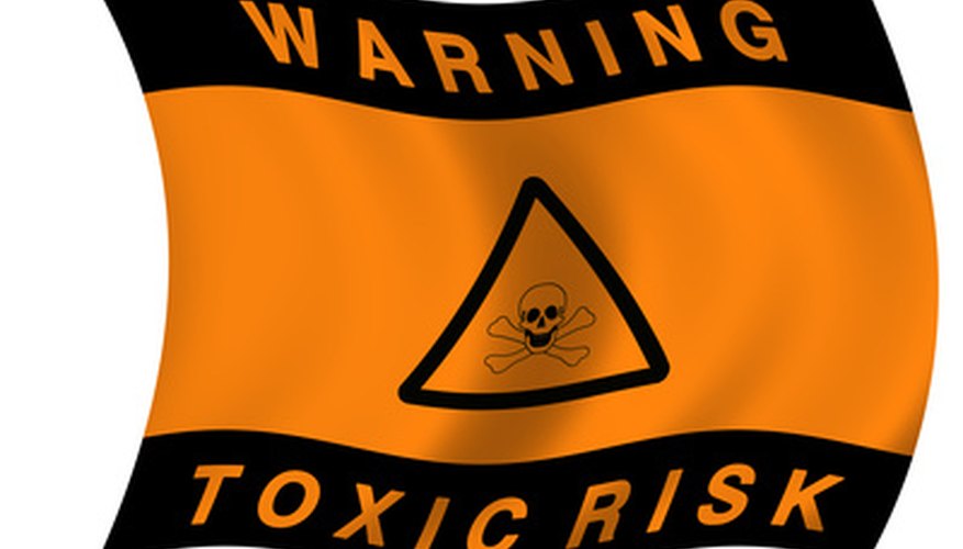 Photo Credit: Toxic hazard flag image by Stasys Eidiejus from <a href='http://www.fotolia.com'>Fotolia.com</a> Printing companies use many products that require a MSDS.
