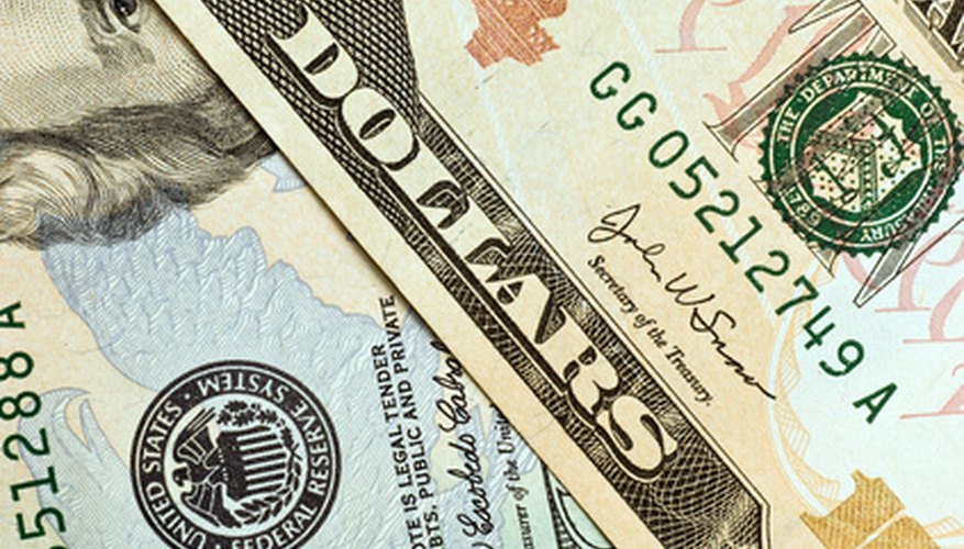 Photo Credit: money texture image by PaulPaladin from <a href='http://www.fotolia.com'>Fotolia.com</a> The texture of money changes periodically to help prevent counterfeiting.