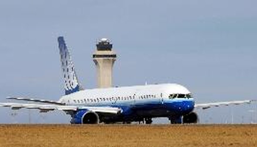 Side view of airplane on runway