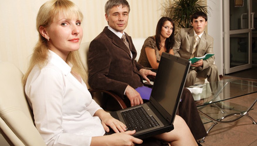 Photo Credit: Group of business people working together in the office.. image by Andrey Kiselev from <a href='http://www.fotolia.com'>Fotolia.com</a> Good preparation is key to an accurate schedule.