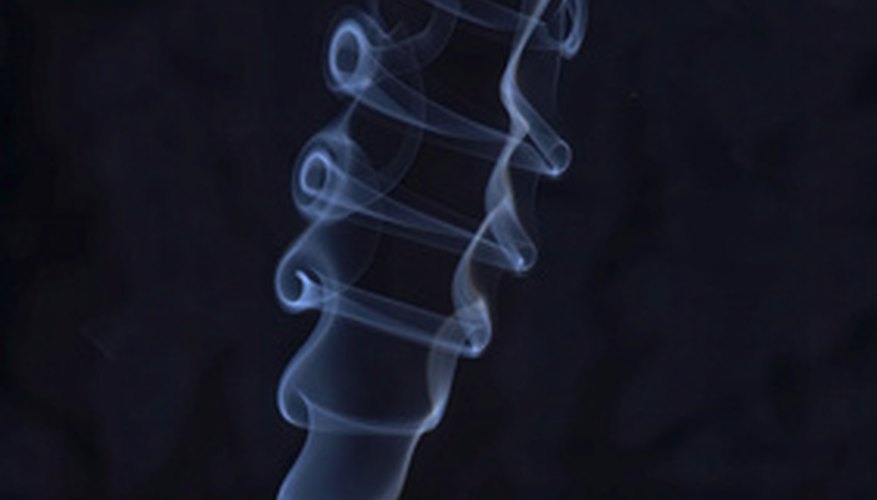Photo Credit: smoke image by Oleg Tarasov from <a href='http://www.fotolia.com'>Fotolia.com</a> Mineral oil can be used to create smoke, but should be done with caution.